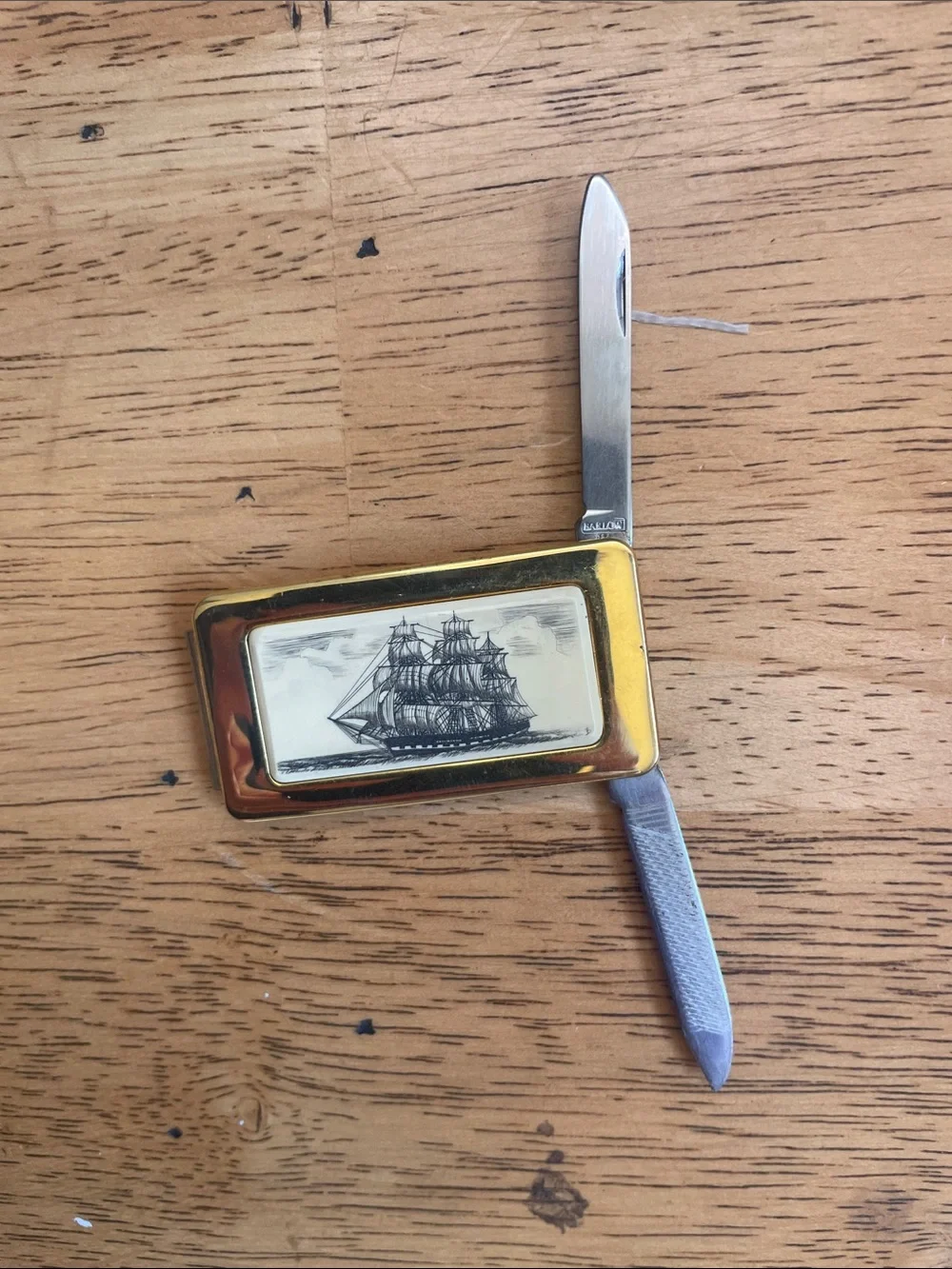 Gold-Tone Ship Engraved Money Clip with knife and file.